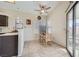 Cozy dining area featuring a ceiling fan and sliding door to the backyard at 6982 Rusty Nail Way, Las Vegas, NV 89119