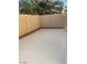 Backyard area featuring a concrete patio and block wall for privacy at 7439 S Pioneer Way, Las Vegas, NV 89113