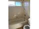 Bright bathroom featuring a tub-shower combination, and a window providing natural light at 7439 S Pioneer Way, Las Vegas, NV 89113
