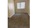 Cozy bedroom with carpeted floors and a window providing natural light at 7439 S Pioneer Way, Las Vegas, NV 89113