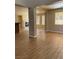Spacious living room featuring wood-look tile flooring, fireplace, and neutral paint colors at 7439 S Pioneer Way, Las Vegas, NV 89113