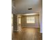Bright living room with high ceilings, wood-look tile flooring and plenty of natural light at 7439 S Pioneer Way, Las Vegas, NV 89113
