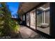 Bathroom featuring an outdoor stone patio with elegant greenery, glass doors, and a soaking tub at 751 Wexler Ct, Las Vegas, NV 89107