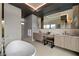 Modern bathroom with double vanities, sleek fixtures, and a soaking tub, offering a serene and stylish space at 751 Wexler Ct, Las Vegas, NV 89107
