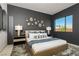 Stylish bedroom featuring a comfortable bed, modern lighting, and elegant decor at 751 Wexler Ct, Las Vegas, NV 89107
