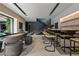 Entertaining area with seating at the bar, a game table and a staircase at 751 Wexler Ct, Las Vegas, NV 89107
