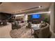 Entertaining area with couch and bar in an open living area with modern decor and lighting at 751 Wexler Ct, Las Vegas, NV 89107
