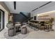 Game and entertaining area showcases an extra large bar with counter seating, a game table, and a staircase at 751 Wexler Ct, Las Vegas, NV 89107