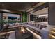 Outdoor living area with cushioned seating around a fire pit in a covered patio at 751 Wexler Ct, Las Vegas, NV 89107