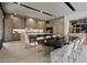 Elegant eat in kitchen with an island with a marble countertop, stainless steel appliances, and sleek cabinetry at 751 Wexler Ct, Las Vegas, NV 89107