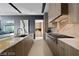 Gourmet kitchen with marble countertops, custom cabinetry and state-of-the-art appliances at 751 Wexler Ct, Las Vegas, NV 89107