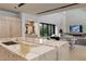 A bright open kitchen with a large island, modern appliances and a view into the living room at 751 Wexler Ct, Las Vegas, NV 89107