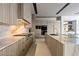 A luxury kitchen with an island featuring marble countertops and stainless steel appliances at 751 Wexler Ct, Las Vegas, NV 89107