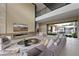 Luxurious living room with a modern fireplace, comfortable seating, and views of the pool at 751 Wexler Ct, Las Vegas, NV 89107