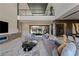 A luxurious living room showcasing a modern design and seamless indoor-outdoor living with a pool view at 751 Wexler Ct, Las Vegas, NV 89107
