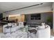 Open living room showcases a long couch with decorative pillows, recessed lights and sleek decor at 751 Wexler Ct, Las Vegas, NV 89107
