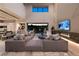 A bright high ceiling living room with modern decor, fireplace, and access to outdoor living space at 751 Wexler Ct, Las Vegas, NV 89107