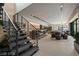 Spacious living area with modern staircase, recessed lights and elegant decor with a view to the patio at 751 Wexler Ct, Las Vegas, NV 89107