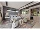 Modern main bedroom with decor lighting, seating area and wet bar at 751 Wexler Ct, Las Vegas, NV 89107