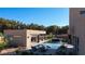 Backyard pool area with lounge chairs, a covered outdoor kitchen, and landscaping at 751 Wexler Ct, Las Vegas, NV 89107