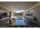 An outdoor lounge and pool area with a modern design, seamlessly blending indoor and outdoor living spaces at 751 Wexler Ct, Las Vegas, NV 89107