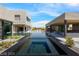 Exterior view featuring a modern pool, connecting the main house to a guest house at 751 Wexler Ct, Las Vegas, NV 89107