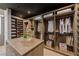 Custom walk-in closet with built-in shelving, drawers, and an island for accessories at 751 Wexler Ct, Las Vegas, NV 89107