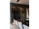 An elegant temperature controlled wine cellar with modern lighting next to the dining room at 751 Wexler Ct, Las Vegas, NV 89107