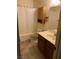 Bathroom with tiled floors, vanity, and a shower with white curtain at 774 Anne Ln, Henderson, NV 89015