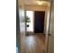 Welcoming entryway featuring light wood flooring and a view into other rooms at 774 Anne Ln, Henderson, NV 89015