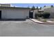 Charming single-story home featuring a two-car garage, desert landscaping, and a gated entrance at 774 Anne Ln, Henderson, NV 89015