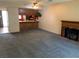 Inviting living room featuring a breakfast bar, fireplace, and carpet flooring, perfect for relaxation at 774 Anne Ln, Henderson, NV 89015