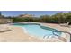 Community pool with ample seating and well-maintained landscaping at 774 Anne Ln, Henderson, NV 89015