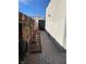 Side yard with fence, garden decor, and stucco wall at 774 Anne Ln, Henderson, NV 89015