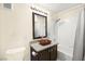 Bright bathroom featuring a modern sink, granite countertop, and shower with a bathtub at 7950 W Flamingo Rd # 2142, Las Vegas, NV 89147