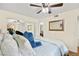 Well-lit bedroom with ceiling fan, closet and bathroom at 7950 W Flamingo Rd # 2142, Las Vegas, NV 89147