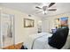 Bedroom featuring hardwood floors, a ceiling fan, and an attached bathroom at 7950 W Flamingo Rd # 2142, Las Vegas, NV 89147