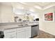 Modern kitchen with stainless steel appliances, white cabinets, and open layout for easy entertaining at 7950 W Flamingo Rd # 2142, Las Vegas, NV 89147