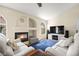 Inviting living room features a cozy fireplace and comfortable seating on a soft blue rug at 7950 W Flamingo Rd # 2142, Las Vegas, NV 89147
