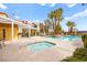 Community pool and spa with lounge chairs and palm trees create a resort atmosphere at 7950 W Flamingo Rd # 2142, Las Vegas, NV 89147