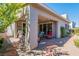Charming backyard with covered patio, lush landscaping, and outdoor grill at 816 Stannard Ct, Henderson, NV 89052