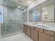 Luxury bathroom featuring double sinks, a spacious glass-enclosed shower, and contemporary fixtures at 816 Stannard Ct, Henderson, NV 89052