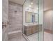 Luxury bathroom featuring double sinks, a spacious glass-enclosed shower, and contemporary fixtures at 816 Stannard Ct, Henderson, NV 89052