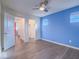 Bedroom features hardwood floors, blue accent wall, and an open closet space at 816 Stannard Ct, Henderson, NV 89052
