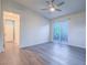 Spacious bedroom features a sliding glass door to the patio, ceiling fan, and laminate wood flooring at 816 Stannard Ct, Henderson, NV 89052