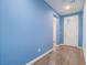 Inviting entryway features hardwood floors and a freshly painted blue accent wall for a modern look at 816 Stannard Ct, Henderson, NV 89052