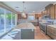Modern kitchen featuring a large island with granite countertop, stainless steel appliances, and ample cabinet space at 816 Stannard Ct, Henderson, NV 89052