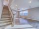 Open-concept living space featuring hardwood floors, staircase, and plenty of natural light at 816 Stannard Ct, Henderson, NV 89052