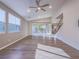 Bright living room with hardwood floors, large windows, and a view of the backyard at 816 Stannard Ct, Henderson, NV 89052