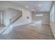 Spacious living room with hardwood floors, staircase, and ample natural light at 816 Stannard Ct, Henderson, NV 89052